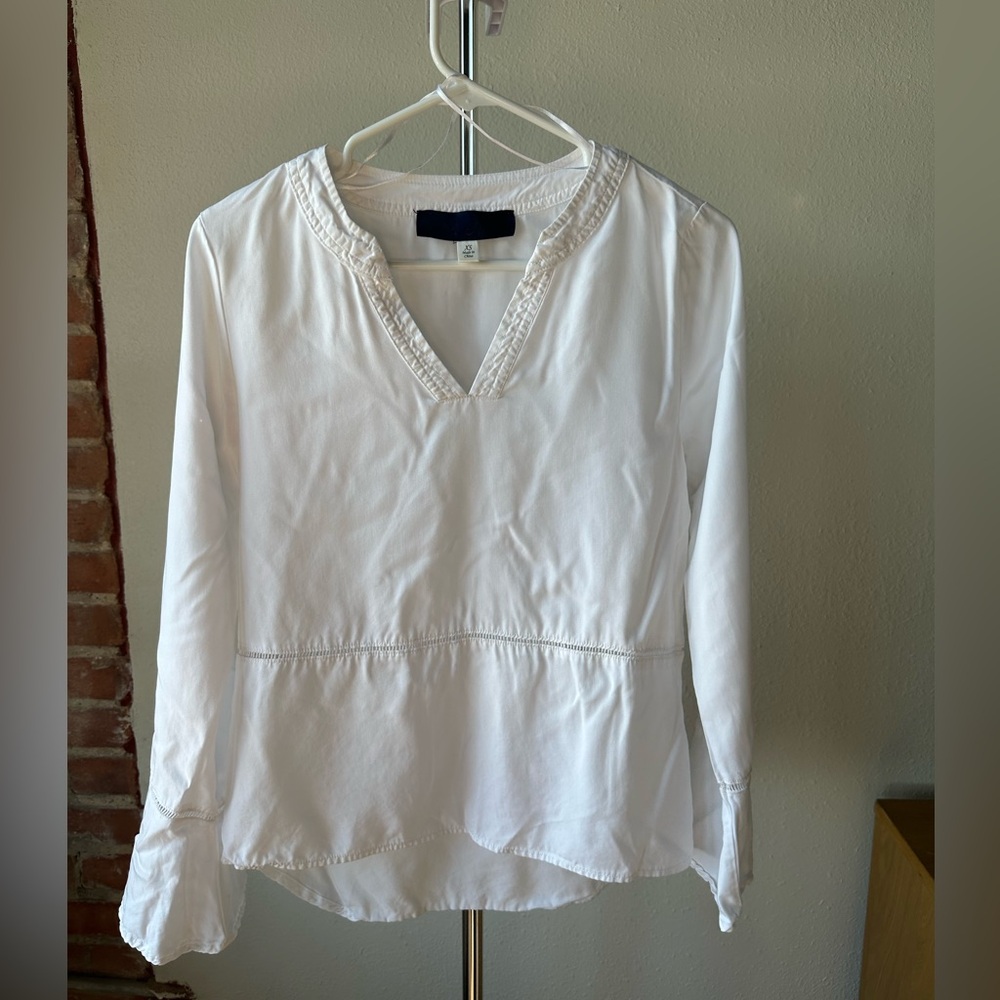 Blue rain (from francesca’s) - white top with see through detail in the middle.